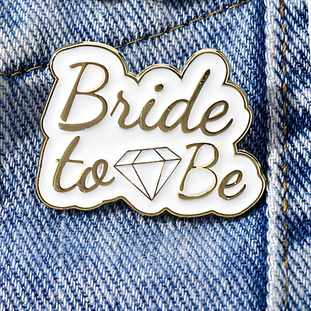 Bride to Be enamel pin with gold script and diamond motif cute bridal lapel pin on denim jacket