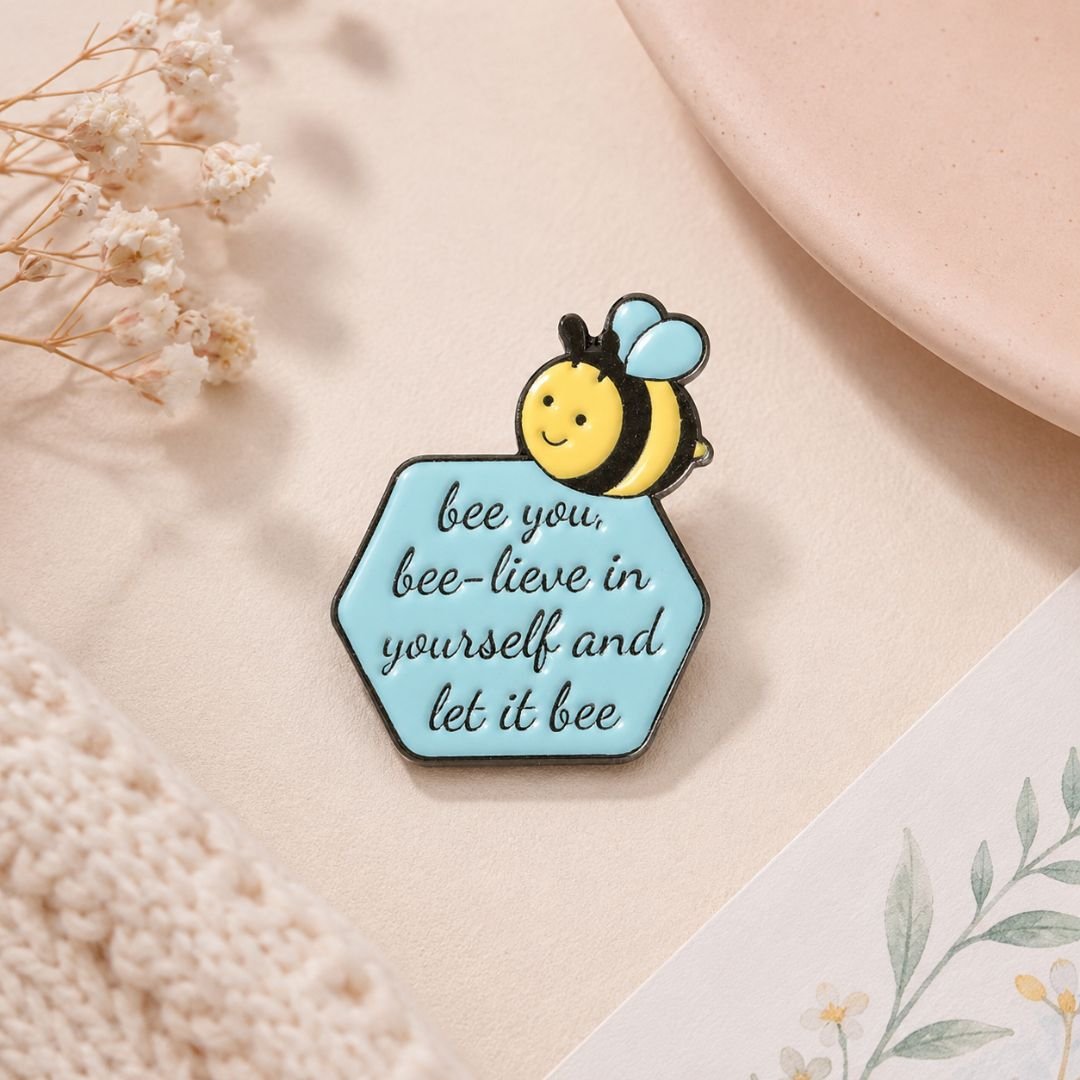 Bee enamel pin on neutral aesthetic background