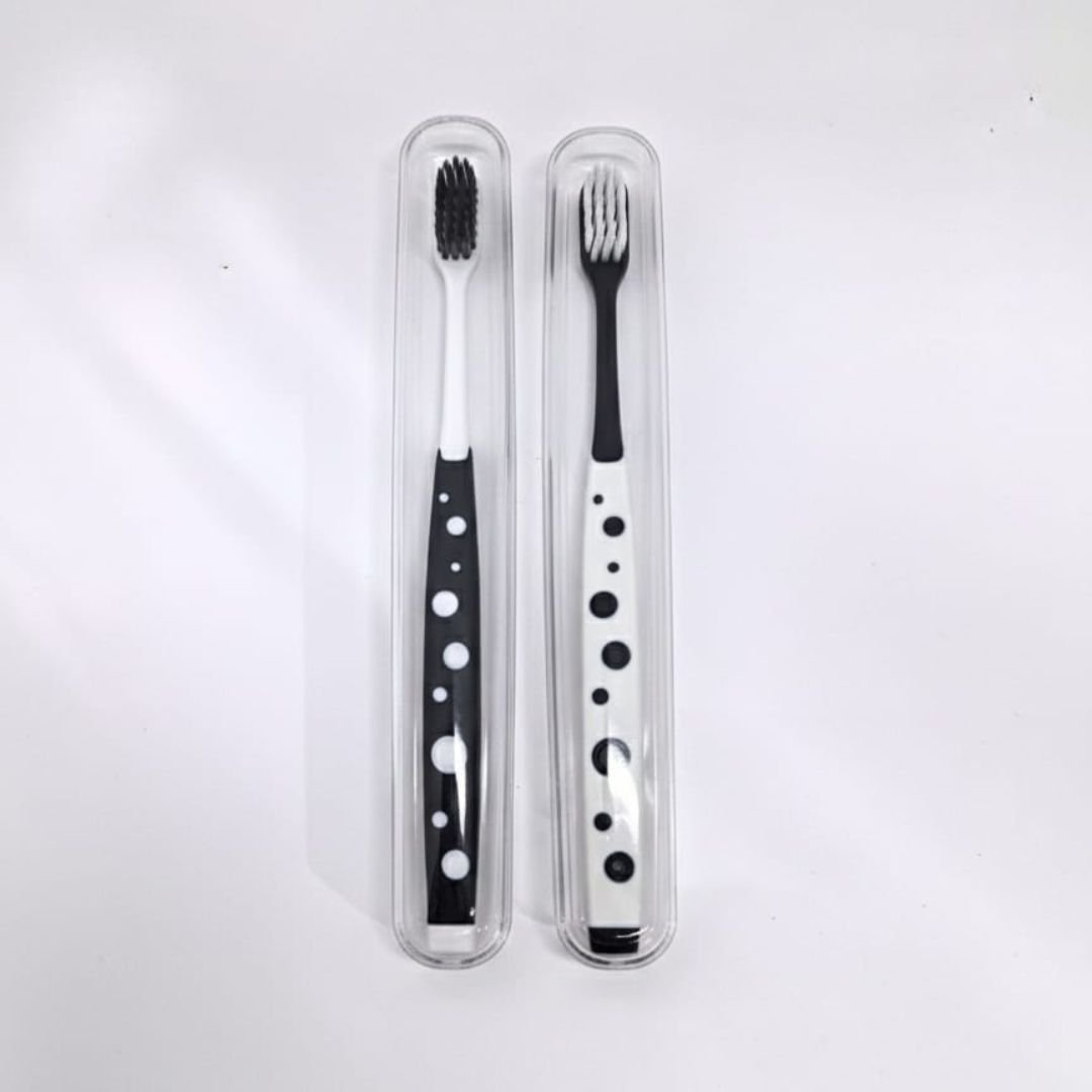 Polka dot toothbrush set with soft bristles and travel case