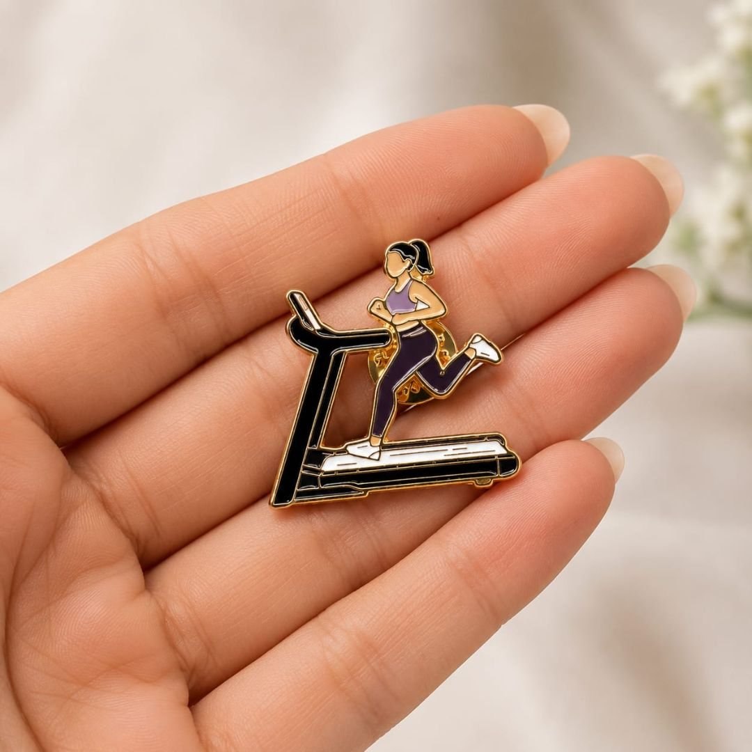 Treadmill running enamel pin held in hand palm fitness lapel pin dried flowers background