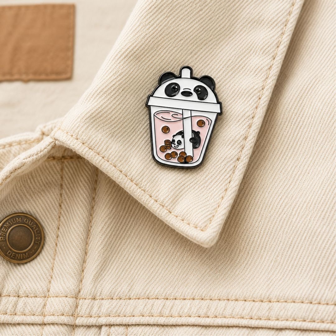 Panda bubble tea enamel pin kawaii boba lapel pin on cream denim jacket collar lifestyle photo