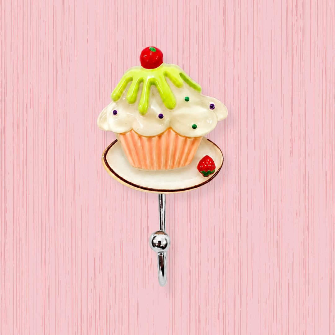Lime green drizzle cupcake wall hook decorative cute home accessory with cherry and strawberry on pink wall