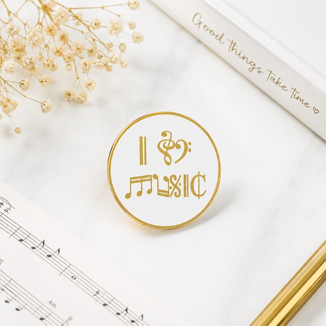 I Love Music hard enamel lapel pin with creative musical symbol design in white and gold.