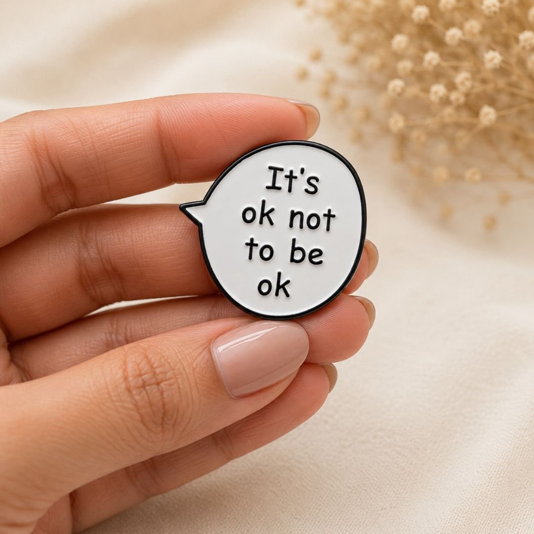 It's OK Not to Be OK enamel pin with speech bubble design